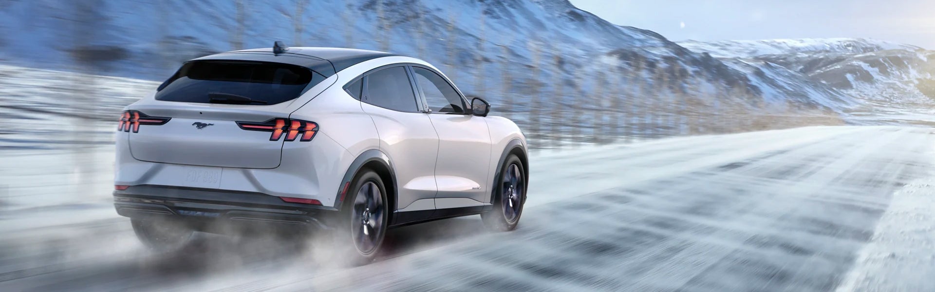 Mustang-Mach-E driving fast on snowy road