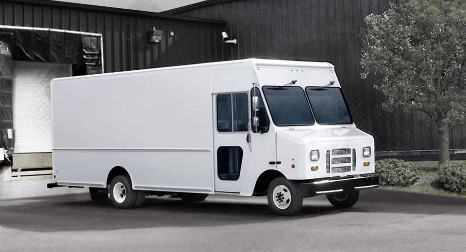 Big van is parked on road.